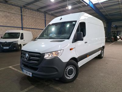 the white van is parked in a large warehouse with other vehicles