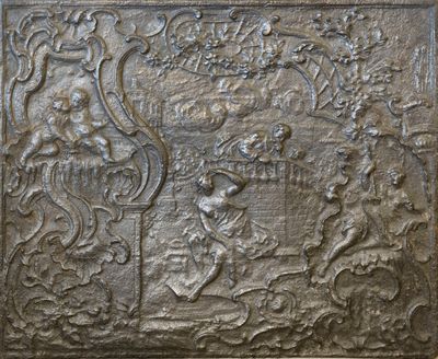 une photo représentant une plaque métallique sur laquelle figurent les portraits d'un homme et d'une femme