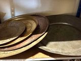 a lot of plates on a shelf in a room