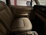 a view of the inside of a car from the driver ' s seat
