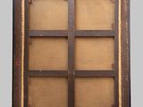 a close up of a wooden frame with a window in it