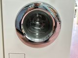 a washing machine that is sitting on the floor