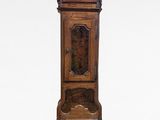 a tall wooden grandfather clock on display against a white background