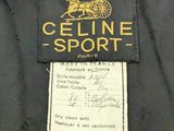 the label of a black jacket with a horse drawn carriage on it