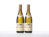 two bottles of wine sitting on top of a white table
