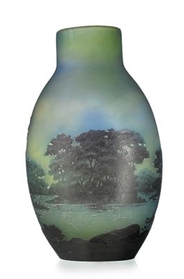 a green vase with a picture of a tree on it