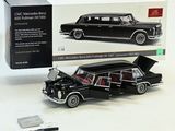 a black model of a car with its hood open