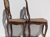 pair of antique chairs with cane backrests and cane backrests