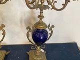 pair of antique brass candelabs with blue glass vases