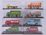 six modèles différents de camions miniatures dans une vitrine