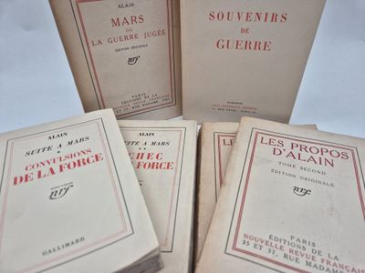 six books of french literature are stacked on top of each other