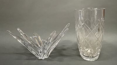 two glass vases sitting next to each other on a table