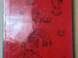 un livre rouge sur lequel est dessiné un dessin représentant une femme et un enfant