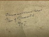 an old envelope with a handwritten message on it sitting on a table
