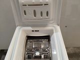 a white toilet with a basket in the middle of it