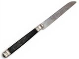 a knife that is sitting on top of a table