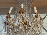 a chandelier hanging from the ceiling in a room