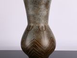 a vase that is sitting on a black table