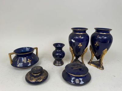 a group of blue vases sitting on a table