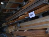 several pieces of wood are stacked on top of each other in a warehouse