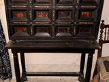 an old wooden cabinet with many drawers on it