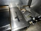 stainless steel counter top in a commercial kitchen with tile flooring