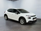 a white citrole car parked in a white room
