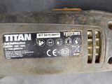 a close up of a corded sander in a car