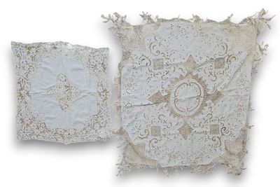 two white pillows with lace on them on a white background