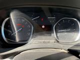 a close up of a car dashboard with a speedometer and gauges