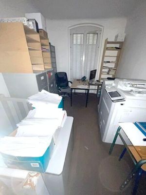 an image of a room with a lot of clutter on the floor