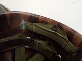 a close up of a helmet with some straps on it