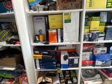 many boxes and boxes on the shelves in the room