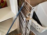 a trash can sitting next to a trash can in the middle of a pile of boxes