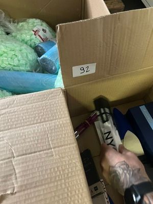a person that is holding a gun in a box