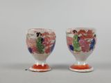 pair of antique japanese porcelain egg cups with hand painted floral designs