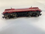 an image of a red train car sitting on top of a white table