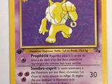 a close up of a pokemon card on a white surface