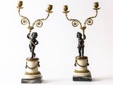 pair of bronze and marble candelabs with figures on pedestals