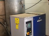 a water heater and a water tank in a room