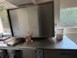 a kitchen with stainless steel counter tops and a dishwasher