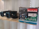 a box of cordless tools on a shelf in a room