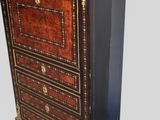 an image of a black and gold chest of drawers with drawers