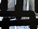 a black and white picture of a window with a blue curtain