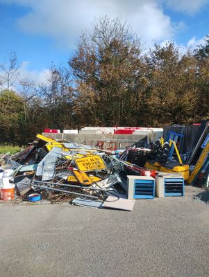a pile of junk in the middle of a parking lot