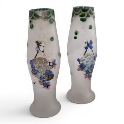 two vases that have been decorated with flowers and birds