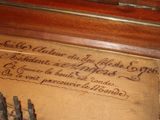 a picture of a wooden box with some scissors in it
