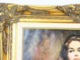 a painting of a woman with long hair in a gold frame
