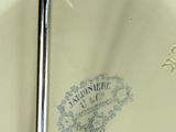 a close up of a plate with a spoon in it