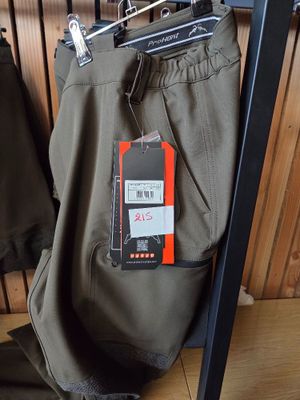 a pair of pants hanging on a rack in a clothing store